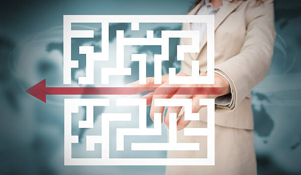 istock Businesswoman tracing red arrow through qr code 500125673