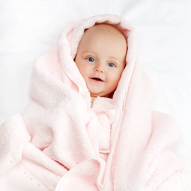 istock Caucasian baby boy covered with pink towel 500130540