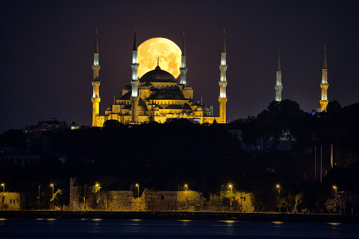 The Blue Mosque and Full Moon Istanbul , Turkey. Blue Mosque or Sultanahmet Mosque in Istanbul, Turkey was built in the 17th century and is a famous landmark today. It is built in the Ottoman style but with many Byzantine characteristics. It is distinguished by being the only major mosque with 6 minarets.