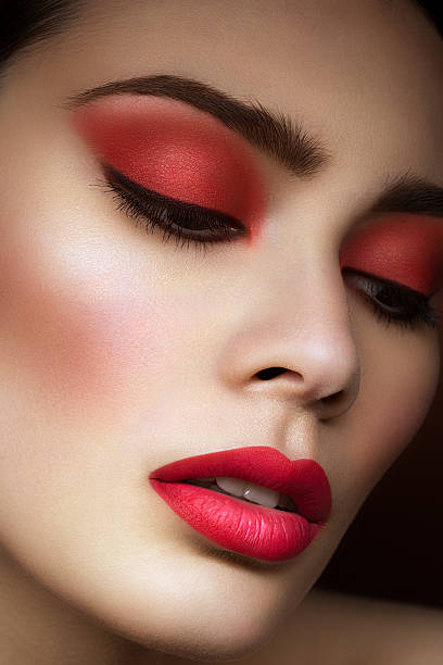 istock Girl with bright red makeup 500132252