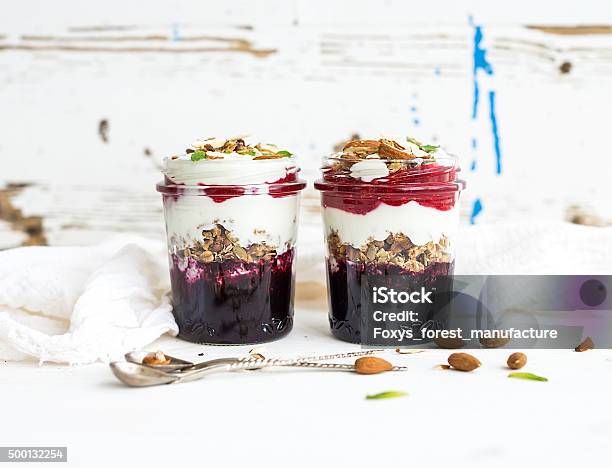 Yogurt Oat Granola With Berries Honey And Nuts In Glass Stock Photo - Download Image Now