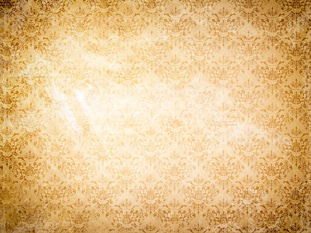 istock Old grunge paper background and floral ornament. 500135122