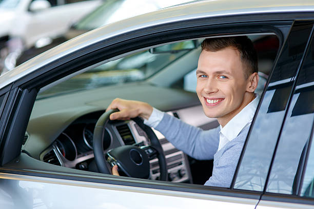 istock Pleasant man choosing car in auto show 500135486