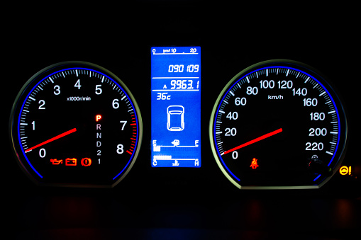Speedometer on Car DashboardModern Car Speedometer and Illuminated Dashboard