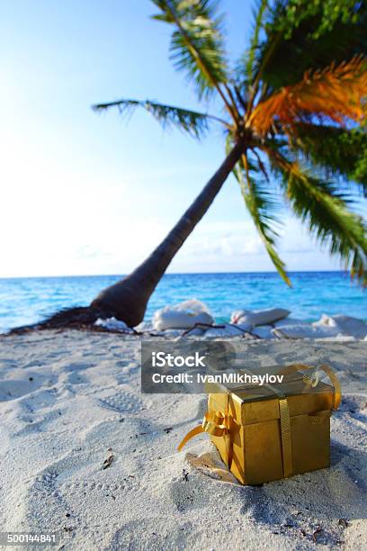 Golden Gift On Ocean Beach Stock Photo - Download Image Now - Beach, Christmas Tree, Bay of Water