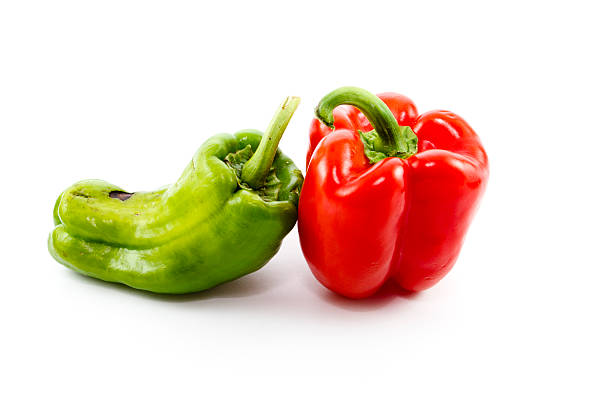 istock Fresh Green and Red Capsicum on white background 500144881