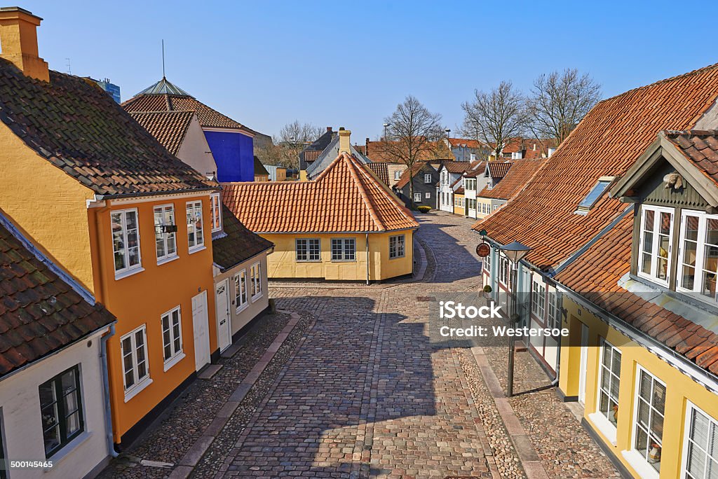 The poet Hans Christian Andersen's childhood home In the historic town with small streets of Odense is the world famous writer Hans Christian Andersen's iconic yellow childhood home. The building is now a museum of the poet's personal belongings. The area is expanded with several buildings that make up the museum with a huge collection of books with copies of all translations into numerous languages ​​and editions of the poet's works. In 2014 Odense starts a huge change in the center to integrate the old and the modern city center. There will also be a new exhibition building with visual interpretations of the poet's fairy tales Hans Christian Andersen Stock Photo