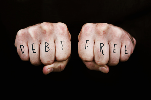 Debt Free written across the knuckles of two clenched fists.  Note that the font design is my own.