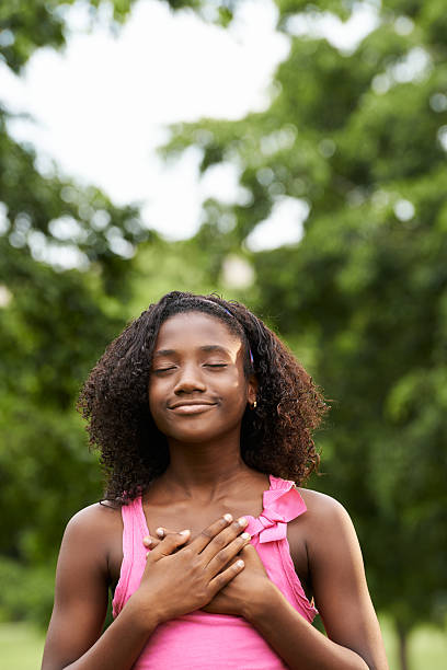 Portrait of black girl in love daydreaming and smiling stock photo