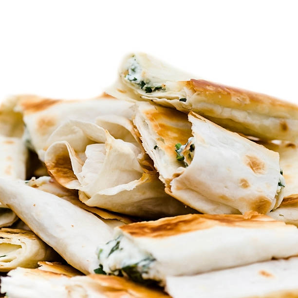 istock Fresh sandwich appetizers closeup. Small lavash rolls. 500149149