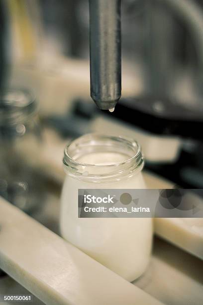 Conveyor With Bottles Filled With Milk Products Selective Focus Stock Photo - Download Image Now