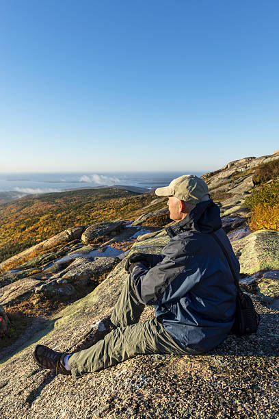 Man Enjoying View on Mountain Hike stock photo