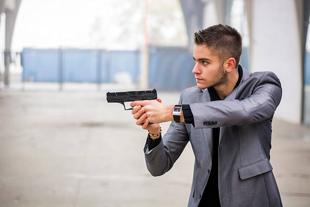 istock Detective, mobster or policeman aiming a firearm 500156094