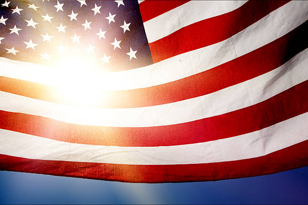 istock American Flag with Sun Flare 500156308