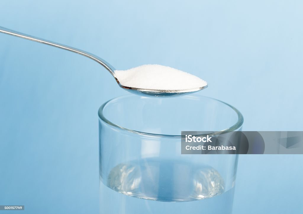 Alkaline Diet Daily alkalizing with sodium  bicarbonate in a glass of water. Alkaline Stock Photo