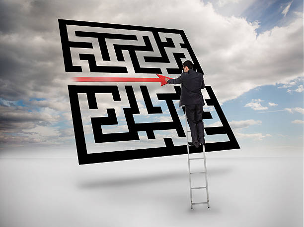 istock Businessman on ladder drawing red line through qr code 500158801