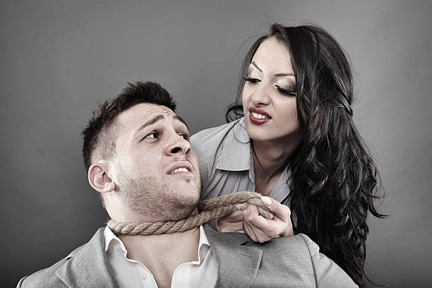 istock Man being tied by his neck with a rope 500159755