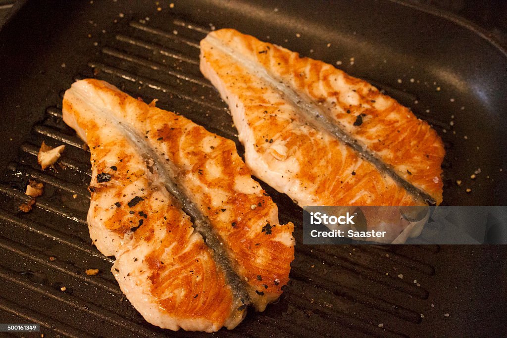 Grilled salmon medallion Grilled salmon medallion on a grilling pan Fish Stock Photo