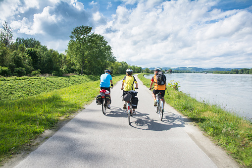 Wachau Valley,Austria-May 9,2014:People are riding bcycle at cycle path near danube river in Austria during a sunny day
