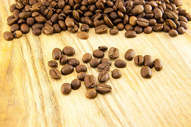 istock Coffee beans on vintage wooden board 500161840