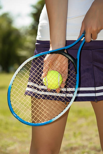 istock Female hand holding tennis racket 500161891