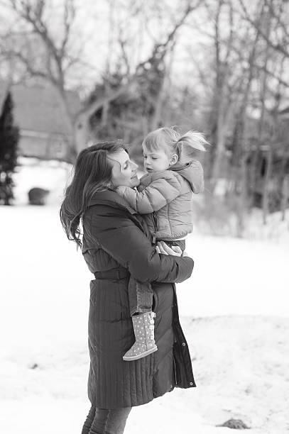 istock Expecting Mother and Daughter During Winter 500162705
