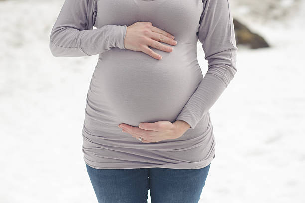 istock Newly Expecting Mother During Winter 500162707