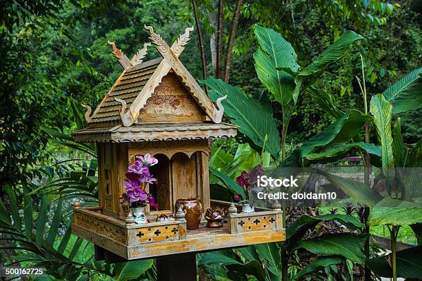 Spirit House In Thailand With Flowers Stock Photo - Download Image Now - Art, Art And Craft, Artificial