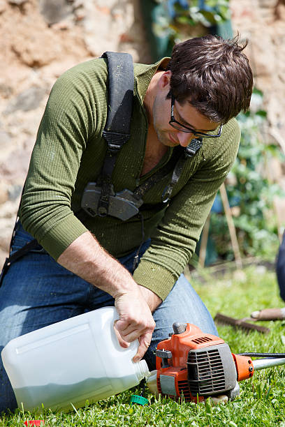 istock Man fills grass trimmer with gasoline 500163597