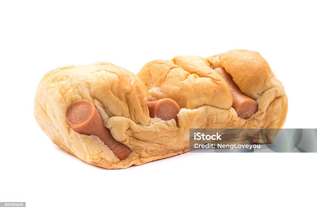 Sausage in baked bread Sausage in baked bread isolated on white background Appetizer Stock Photo
