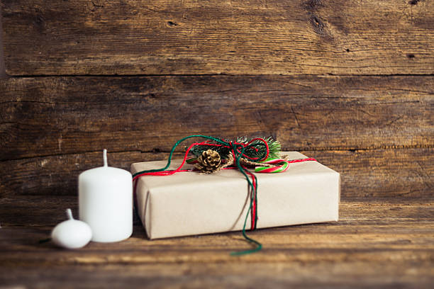 istock Christmas presents on a wooden background with candy cane 500170662