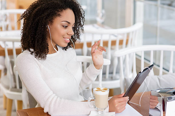istock Young woman using tablet and headphones 500171382