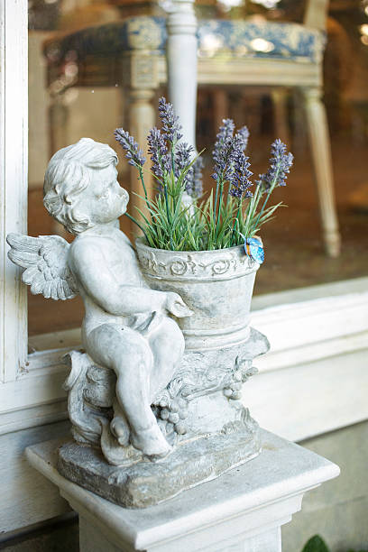 istock close up stone angel doll 500171809