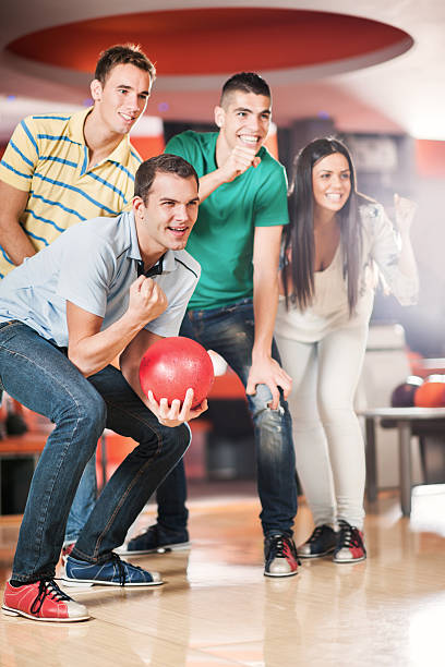 istock Happy friends supporting their bowling team. 500173677