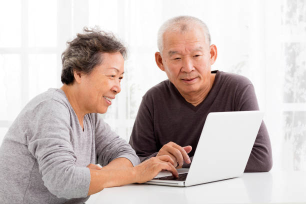 istock happy Senior Couple Using Laptop in living room 500173748