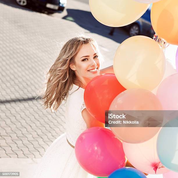 Beautiful Lady Holding A Bunch Of Balloons Stock Photo - Download Image Now - Women, Balloon, Celebration