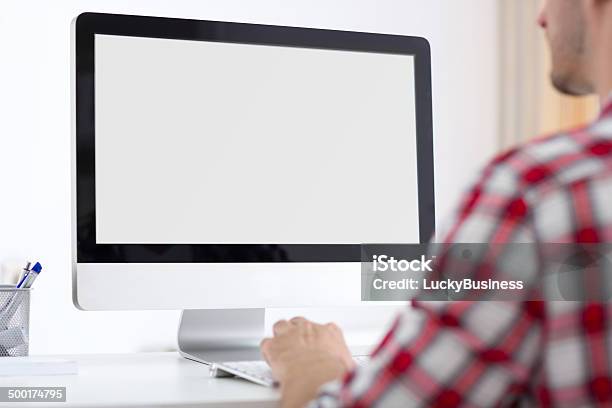 Person Front Of Computer Monitor Stock Photo - Download Image Now - Rear View, Using Computer, Men