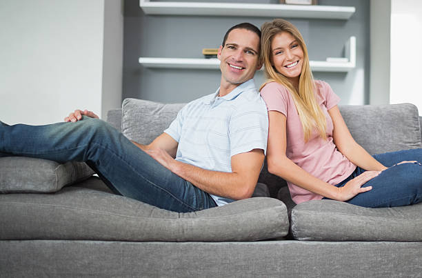 istock Relaxed couple sitting on the couch together 500175249