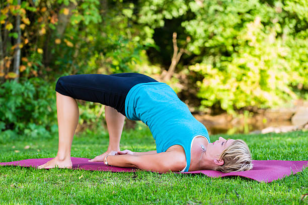 istock Young woman in nature doing yoga 500175717