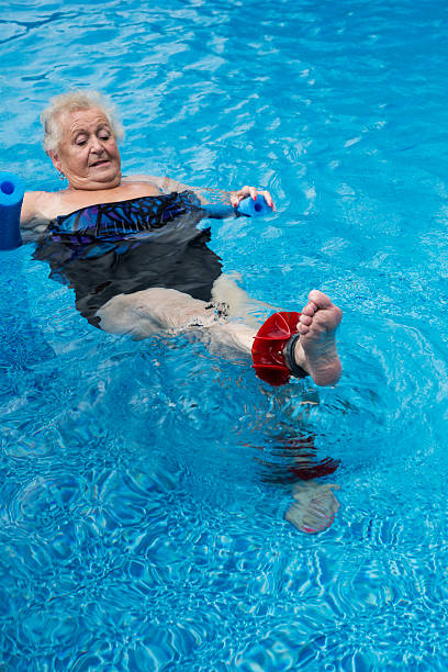 istock Mature woman exercising in the pool 500178235