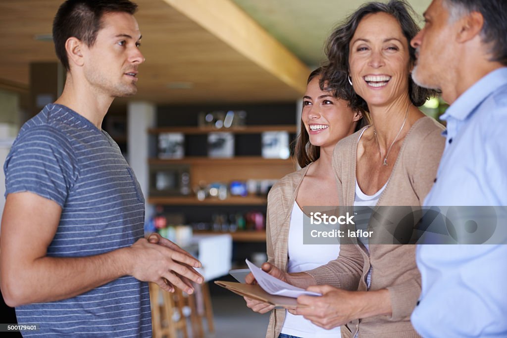 Evening family catch-ups A shot of a happy family spending time together at homehttp://195.154.178.81/DATA/i_collage/pu/shoots/784548.jpg Adult Offspring Stock Photo