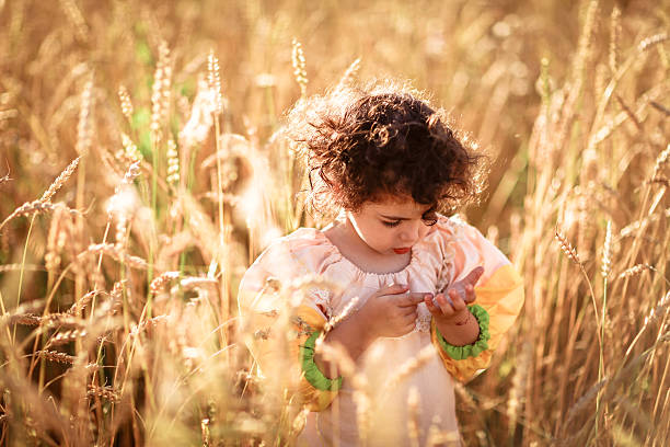 istock child in a field of wheat 500183896