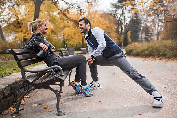 istock Athletic couple resting after exercising in the park. 500185972