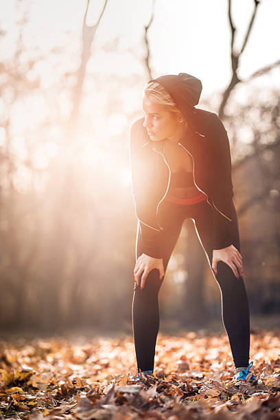 istock Athletic woman taking a breath after exercising at sunset. 500187530