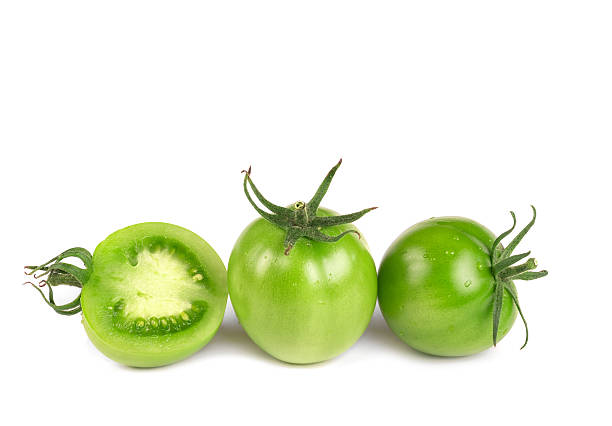 istock Green tomatoes isolated on white background 500189102