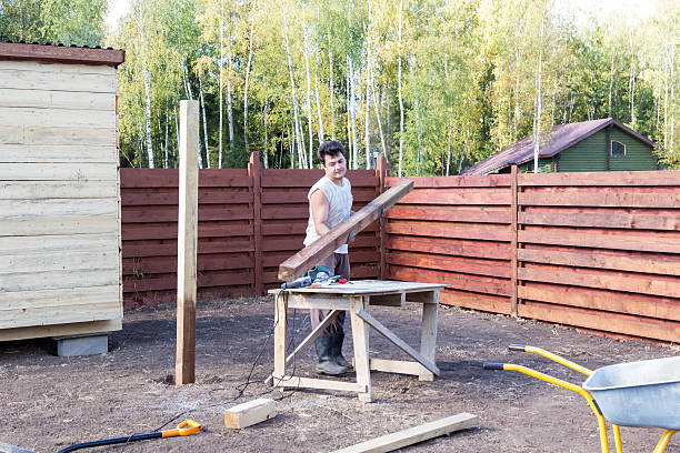 istock man puts wooden beam on the bench 500190102