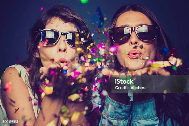 Party Time Stock Photo - Download Image Now - Men, Black Background, Blowing