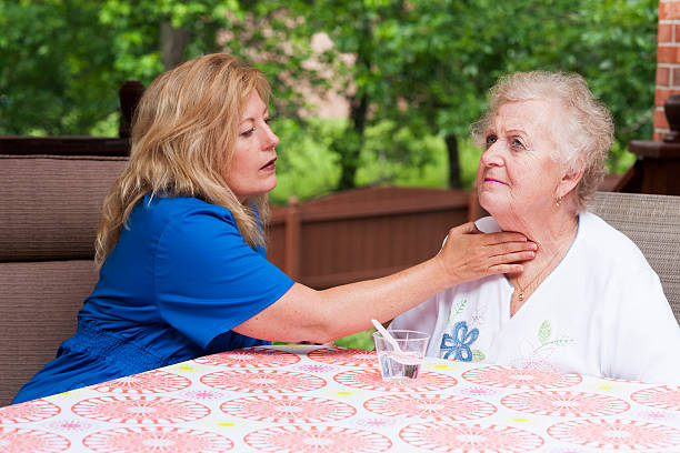Assessing impaired swallowing after a stroke stock photo