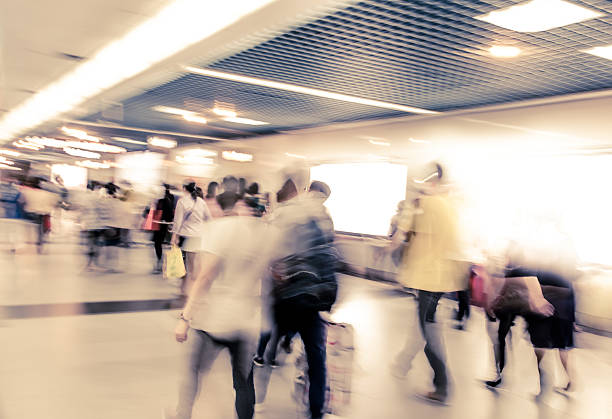 istock group of blur passengers, walking at subway station. 500197019