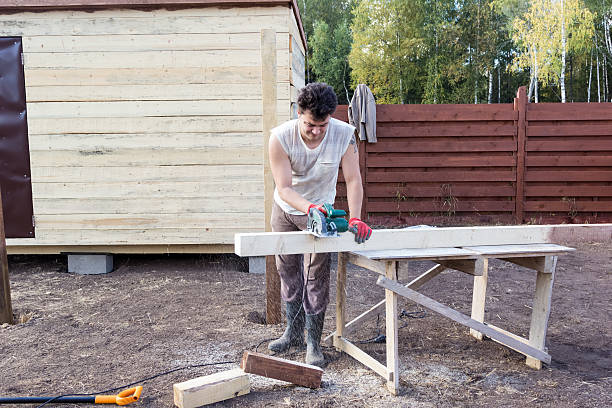 istock man cut wooden beam with circular saw 500198072
